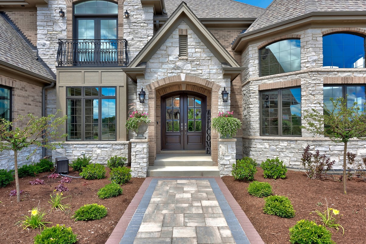 Grand front walkway of stone home